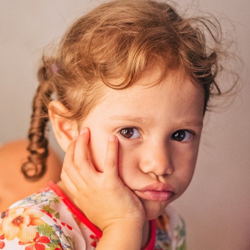 Little girl looking upset